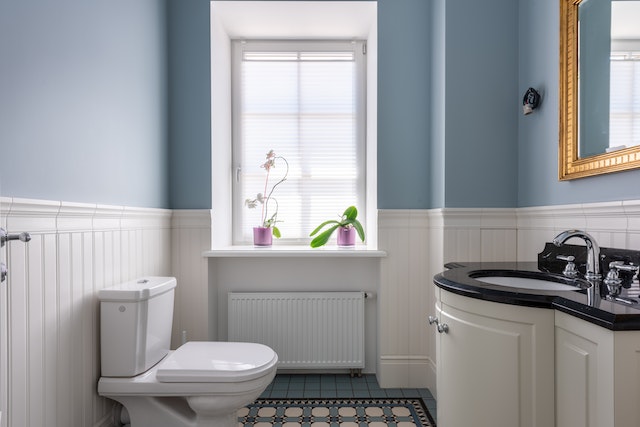 A-well-lit-bathroom-with-light-blue-walls-and-white accents